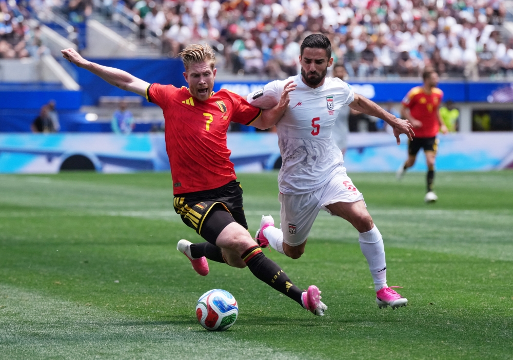 
Belgium's Kevin in action with Iran's Milad. — Reuters