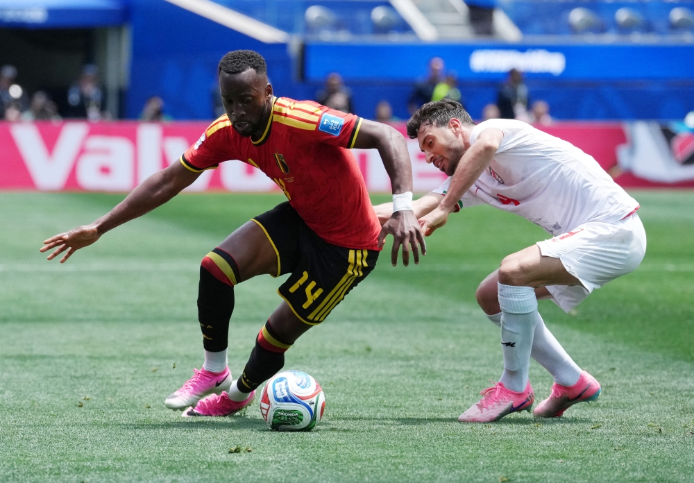 
Belgium's Dodi in action with Iran's Shoja. — Reuters 