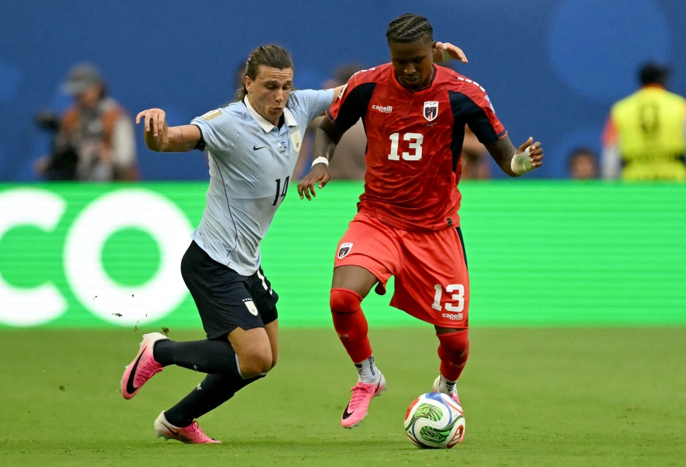 Uruguay's  #14 Agustin and Cabo Verde's #13 Sidney. — AFP