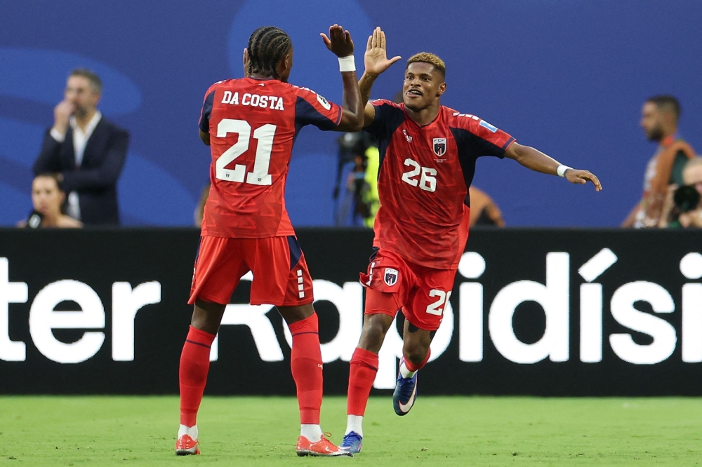Cabo Verde's Helio celebrates scoring their second goal with Mendes. — Reuters