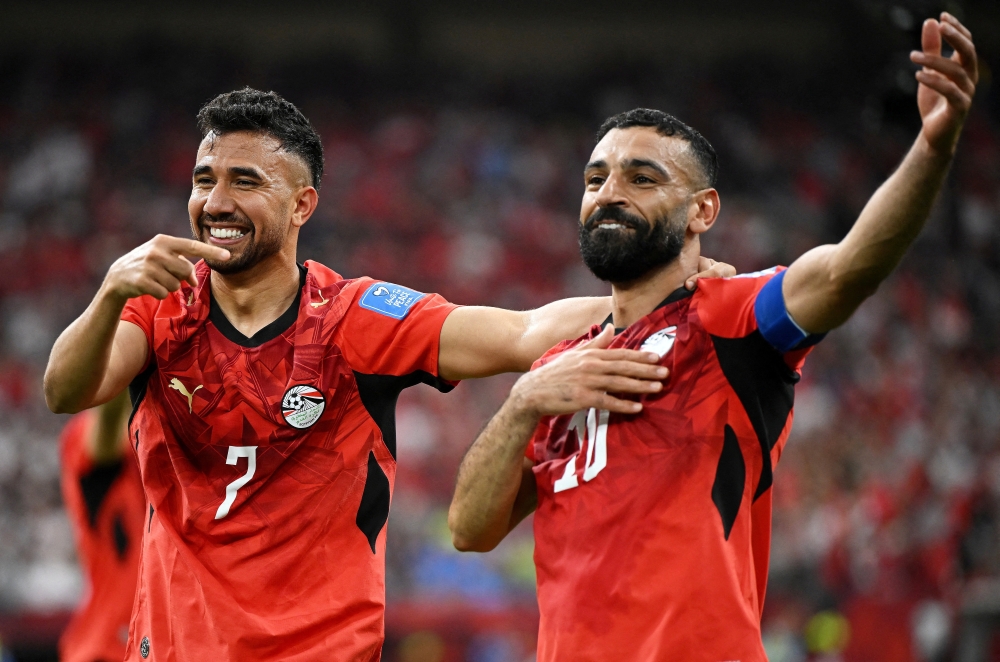  
Egypt's Trezeguet celebrates scoring their third goal with Mohamed Salah. — Reuters  
