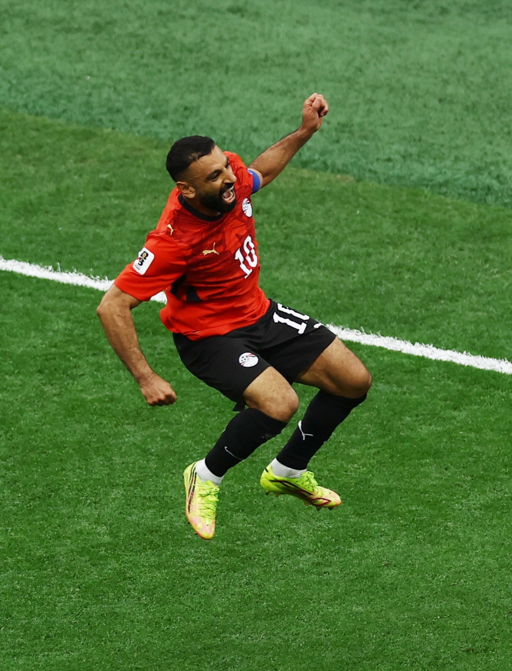  
Egypt's Mahmoud Trezeguet celebrates scoring their third goal. — Reuters 