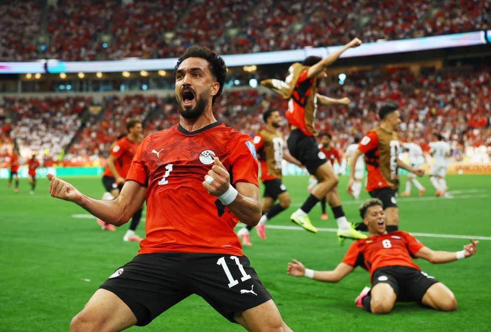  
Egypt's Mostafa Zico celebrates their second goal, scored by Mohamed Salah. — Reuters  