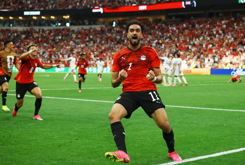  
Egypt's Mostafa Zico celebrates their second goal, scored by Mohamed Salah. — Reuters 
