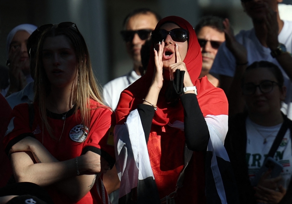  
Egypt fans watch on during the match at San Pedro Square in San Jose 