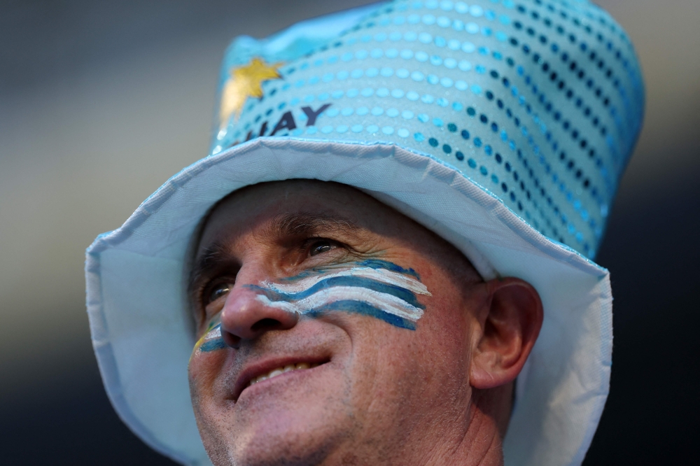 An Uruguayan fan looks v