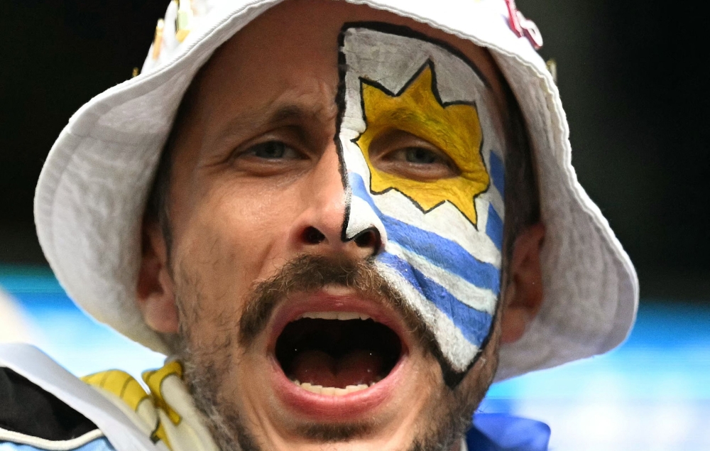 An Uruguayan fan cheers