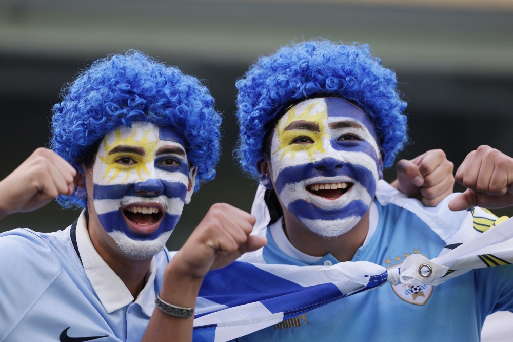 
Cape Verde fans with their faces painted inside the stadium before the match