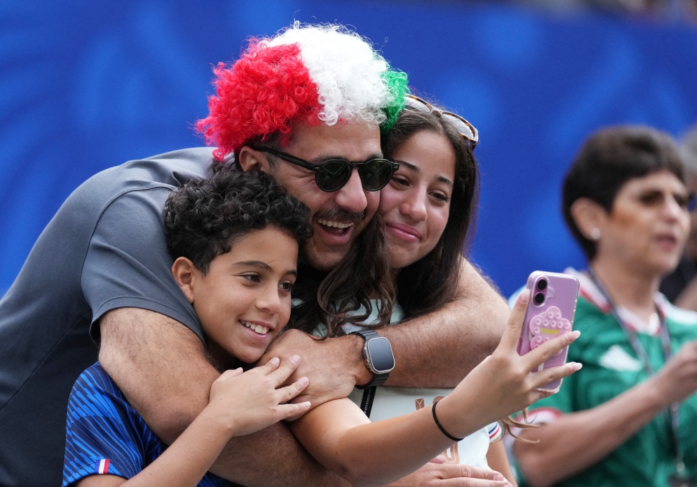 
Fans inside the stadium before the match 