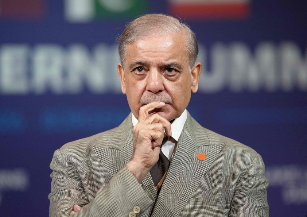 Pakistan's Prime Minister Shehbaz Sharif reacts prior to a quadrilateral meeting between the United States, Iran, Pakistan and Qatar 