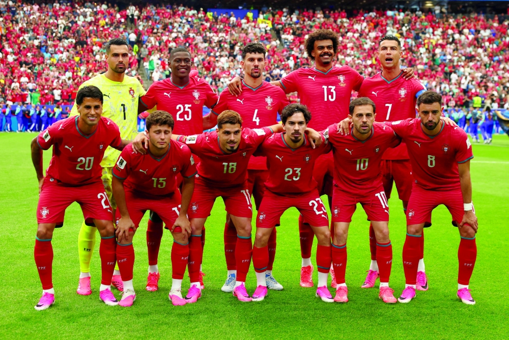 Portugal players pose for a team group photo before the match. — Reuters