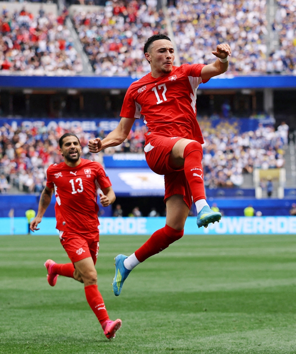  
Switzerland's Ruben Vargas celebrates scoring their second goal with Ricardo Rodriguez. — Reuters  