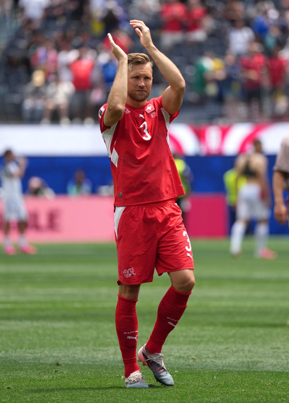 
Switzerland's Silvan Widmer celebrates after the match. — Reuters