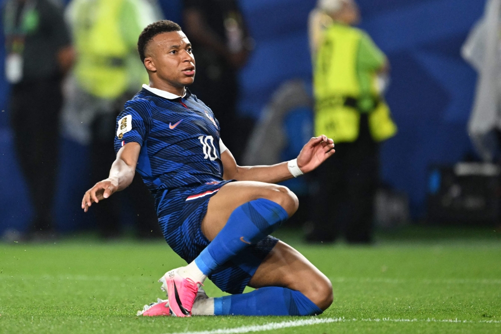 France's forward #10 Kylian Mbappe reacts to a missed chance. — AFP