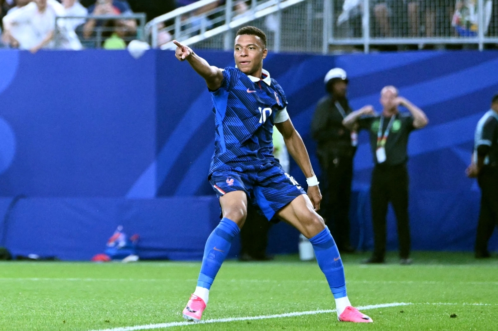 France's  #10 Mbappe celebrates scoring second goal. . — AFP