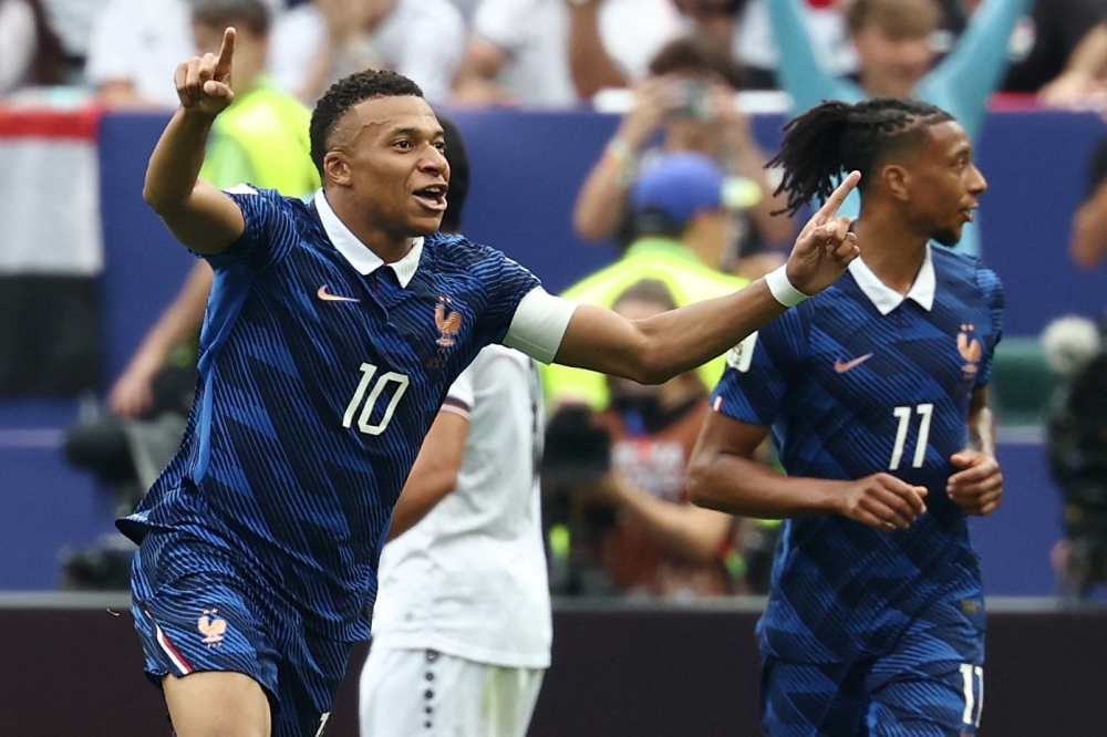 France's #10 Mbappe celebrates scoring first goal. — AFP 