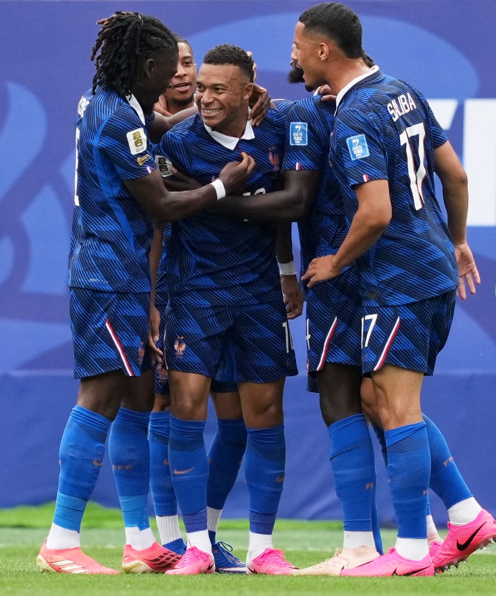  
France's Mbappe celebrates scoring first goal with teammates. — AFP