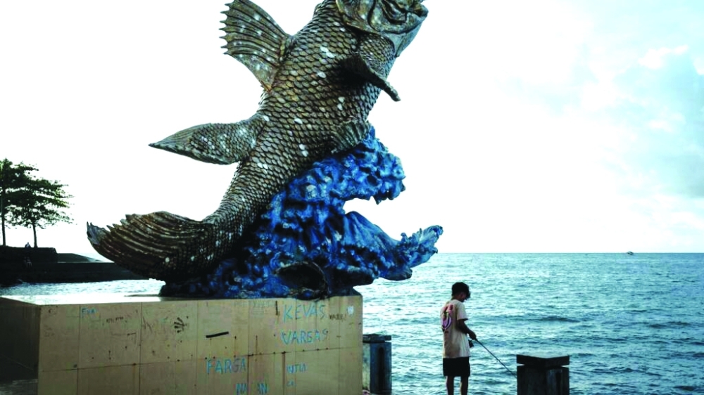 A statue of a coelacanth, an ancient fish often called a “living fossil”, as the second known living species, is seen by the sea in Manado, North Sulawesi. — AFP