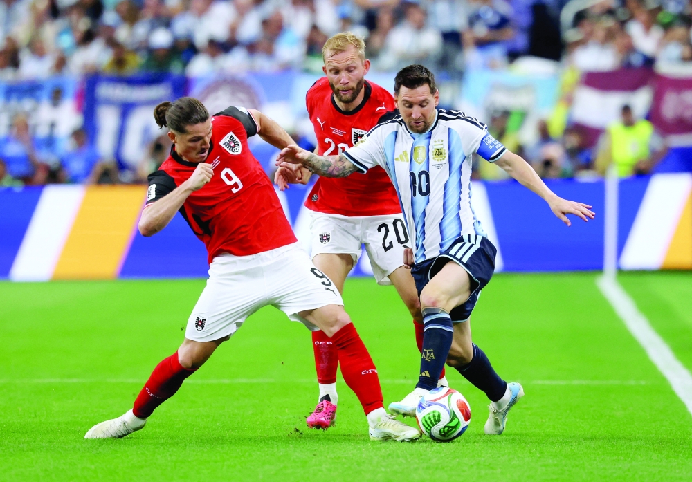 Argentina's Lionel Messi in action with Austria's Marcel Sabitzer and Konrad Laimer. — Reuters