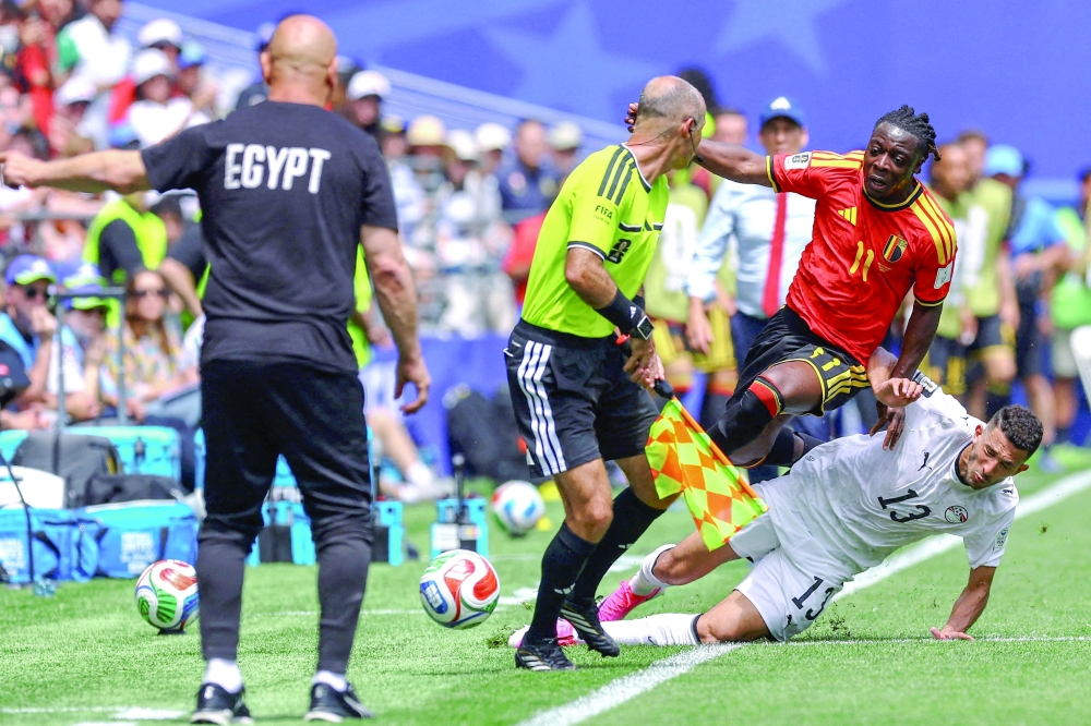 Belgium's Jeremy Doku in action with Egypt's Ahmed Fatouh. — REUTERS