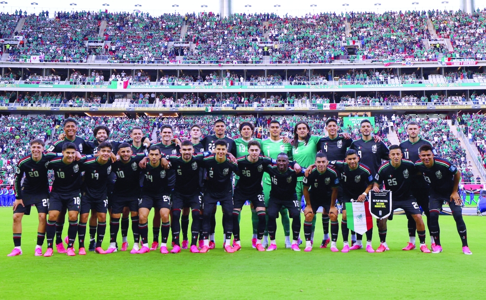 Mexico players pose for a team group photo before the match. — REUTERS