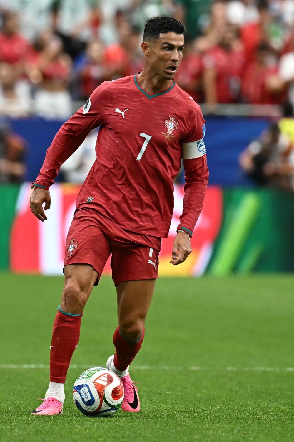 Portugal's forward #07 Cristiano Ronaldo runs with the ball. — AFP
