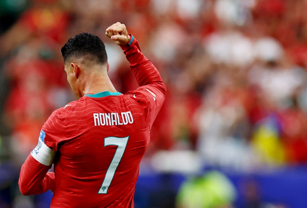  
Portugal's Cristiano Ronaldo celebrates scoring their first goal. — Reuters  