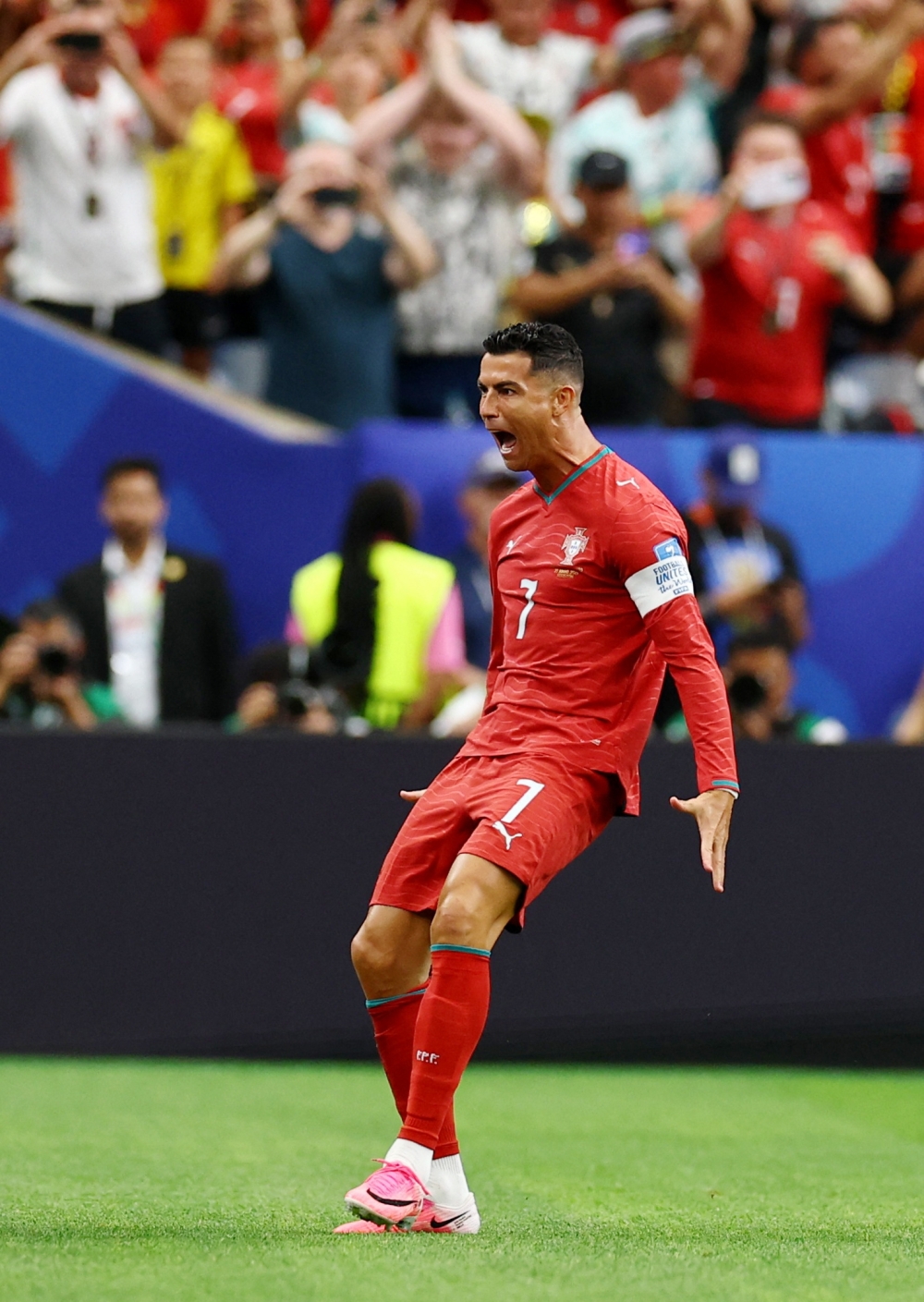  
Portugal's Cristiano Ronaldo celebrates scoring their first goal. — Reuters   