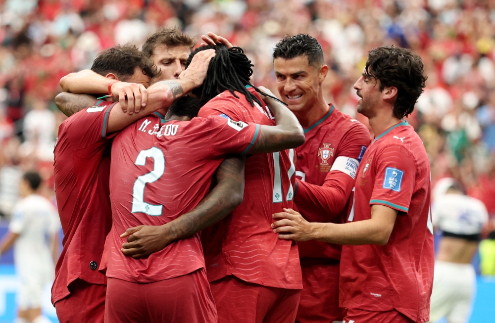  
Portugal's Rafael Leao celebrates scoring their fifth goal with teammates. — Reuters   