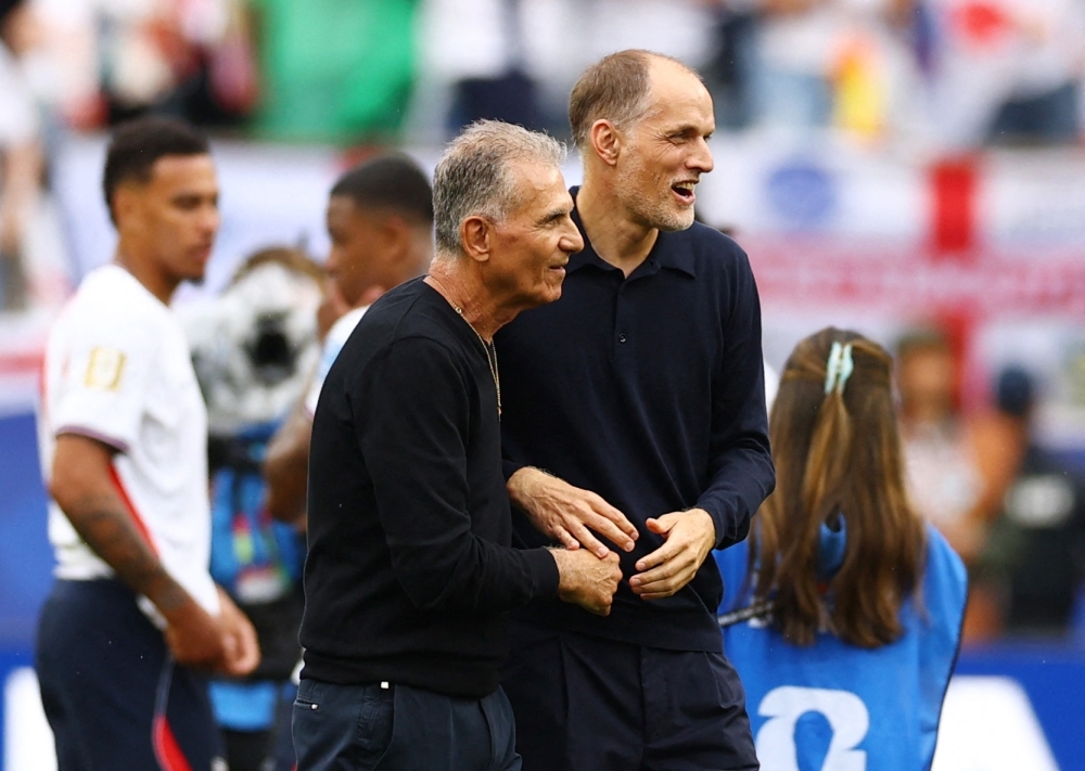  
England manager Thomas Tuchel with Ghana coach Carlos Queiroz after the match. — Reuters