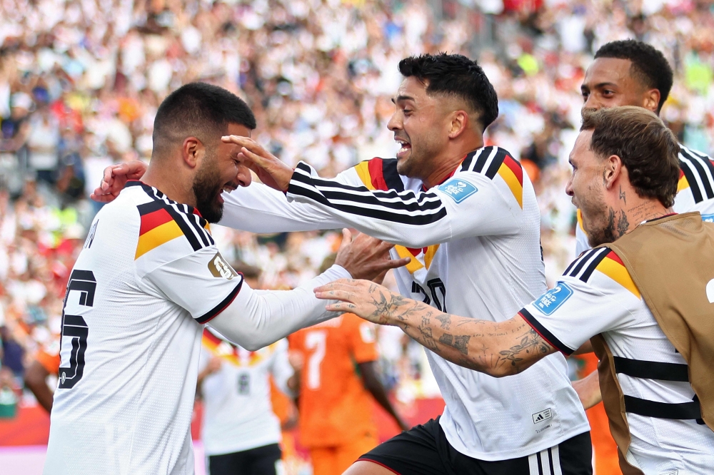 Germany's #26 Deniz Undav (L). — AFP