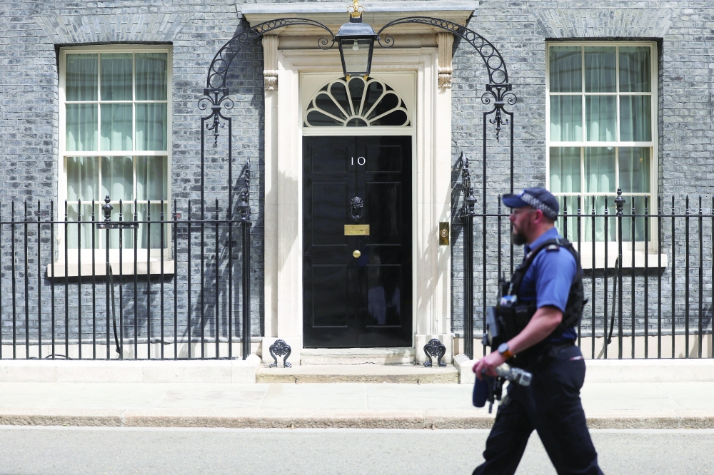 A police officer walks past Number 10 Downing Street in Westminster. — Reuters 