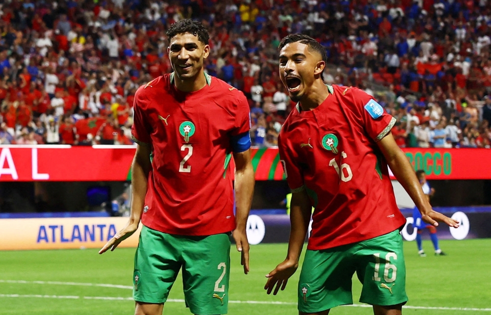  
Morocco's Gessime celebrates fourth goal. — Reuters 