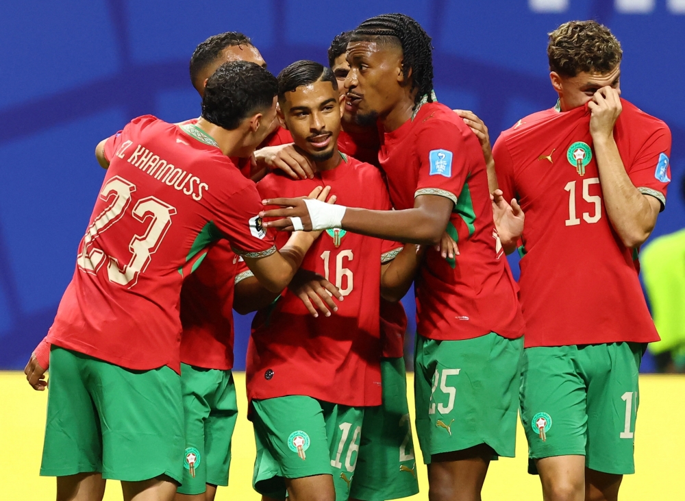  
Morocco's Gessime celebrates fourth goal. . — Reuters   
