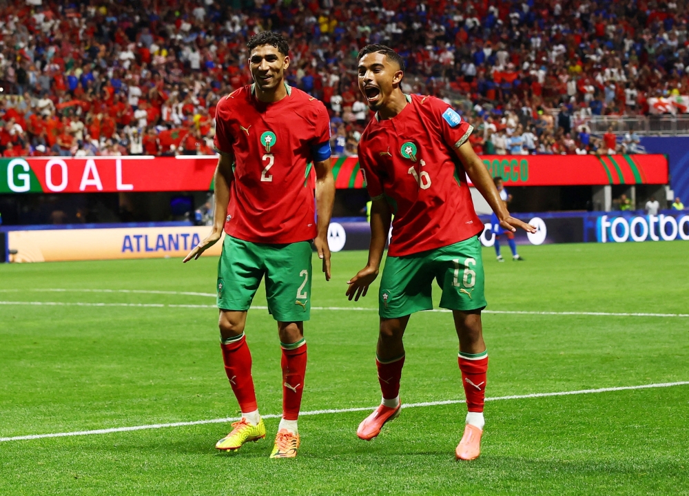  
Morocco's Gessime celebrates fourth goal. — Reuters  