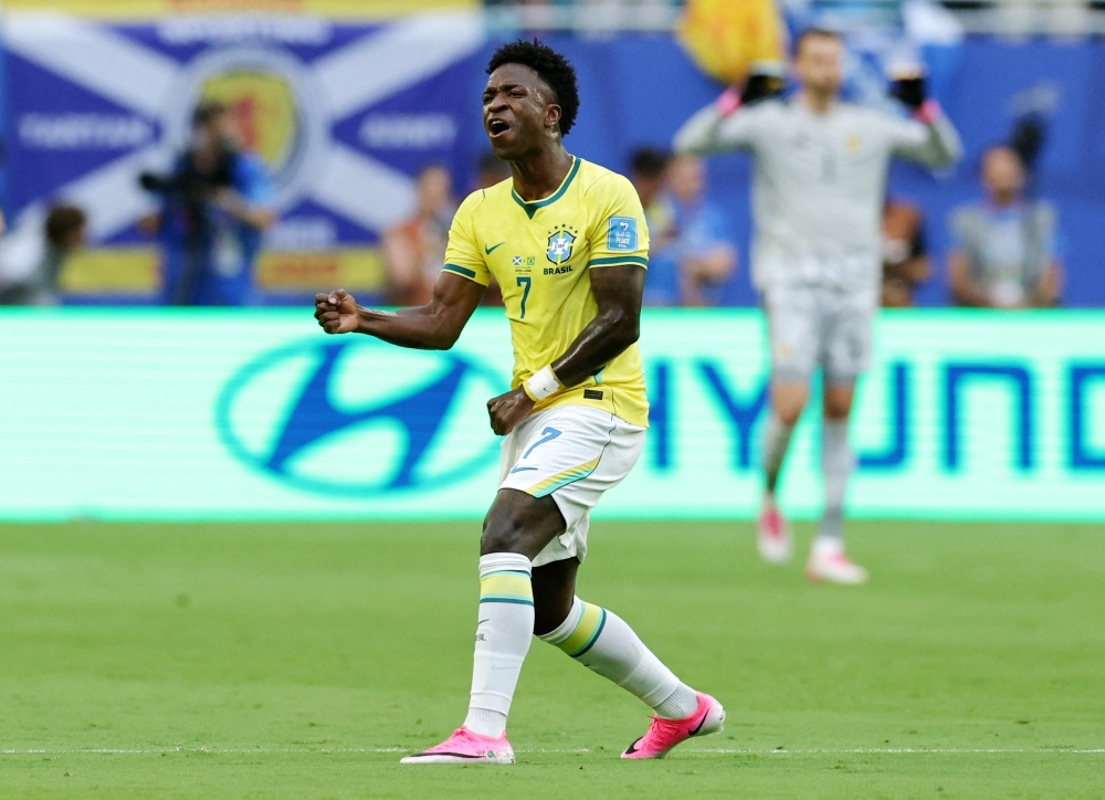  
Brazil's Vinicius celebrates first goal. — Reuters