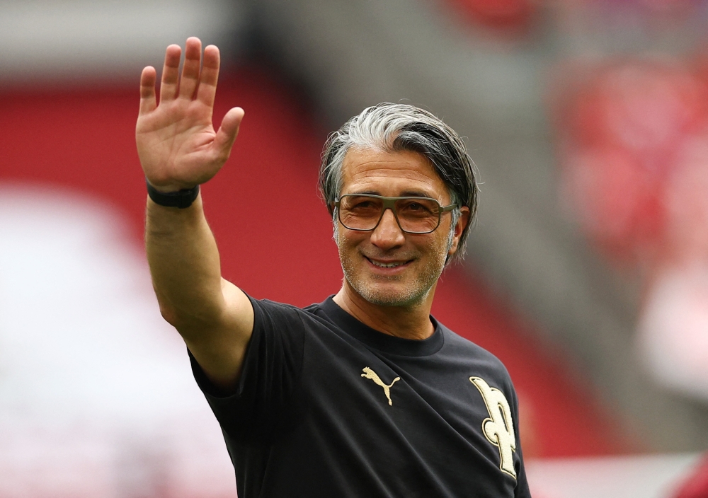 
Switzerland coach Murat Yakin celebrates after the match. — Reuters