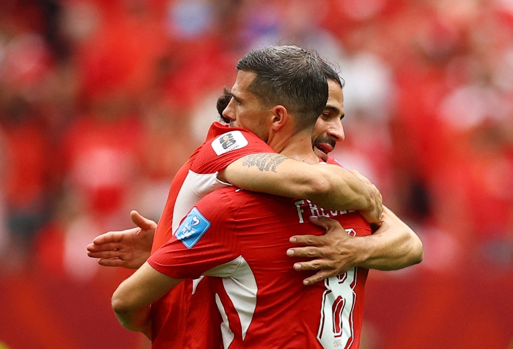  
Switzerland's Freuler and Rodriguez celebrate after the match. — Reuters  