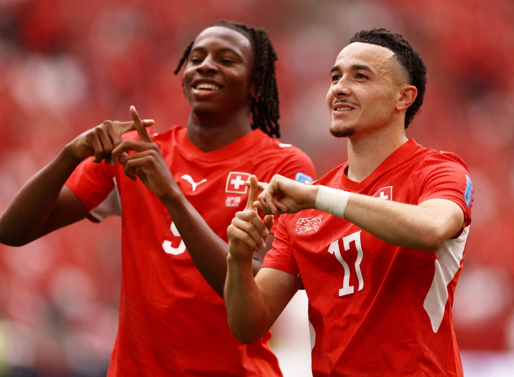  
Switzerland's Vargas celebrates scoring their first goal with Manzambi. — Reuters