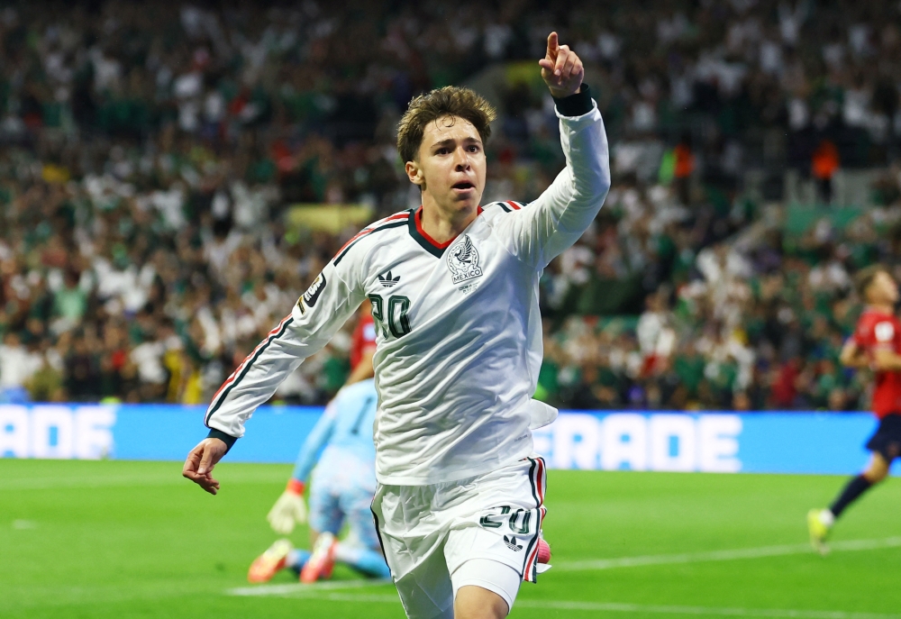  
Mexico's Chavez celebrates scoring their first goal. — Reuters  