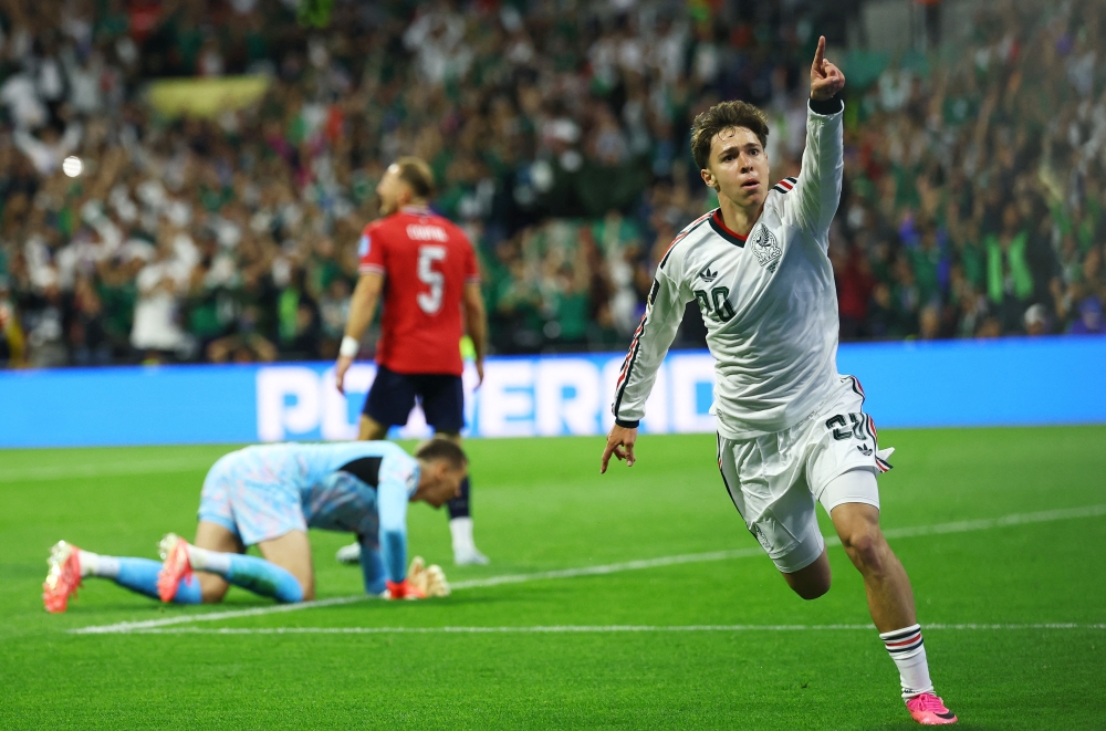  
Mexico's Chavez celebrates scoring their first goal. — Reuters 