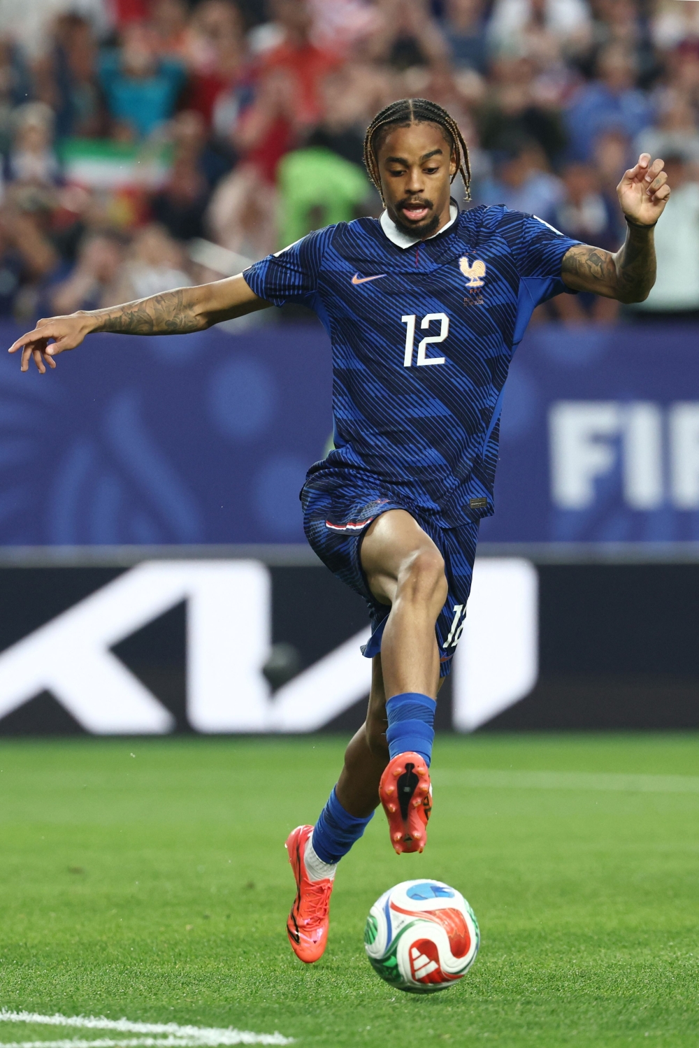 France's forward #12 Bradley Barcola. — AFP