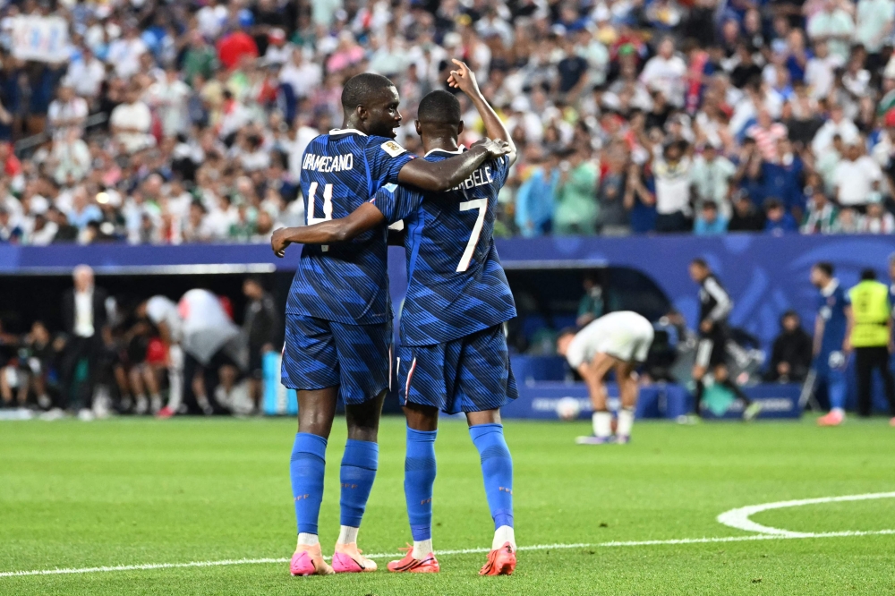 France's #07 Dembele (R) with #04 Upamecano (L). — AFP  