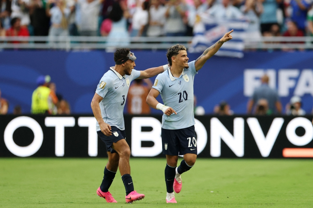 Uruguay's #20 Maximiliano Araujo and #03 Sebastian Caceres. — AFP 