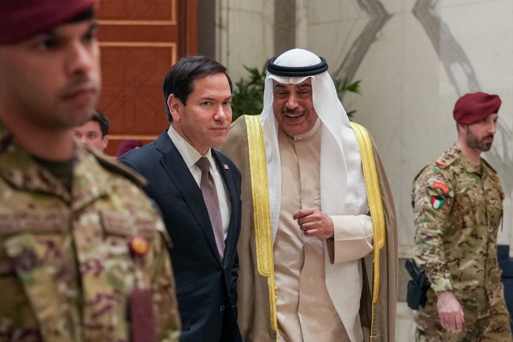 US Secretary of State Marco Rubio walks with Kuwait's Crown Prince Sheikh Sabah Khaled al-Hamad al-Sabah after their meeting at Bayan Palace 