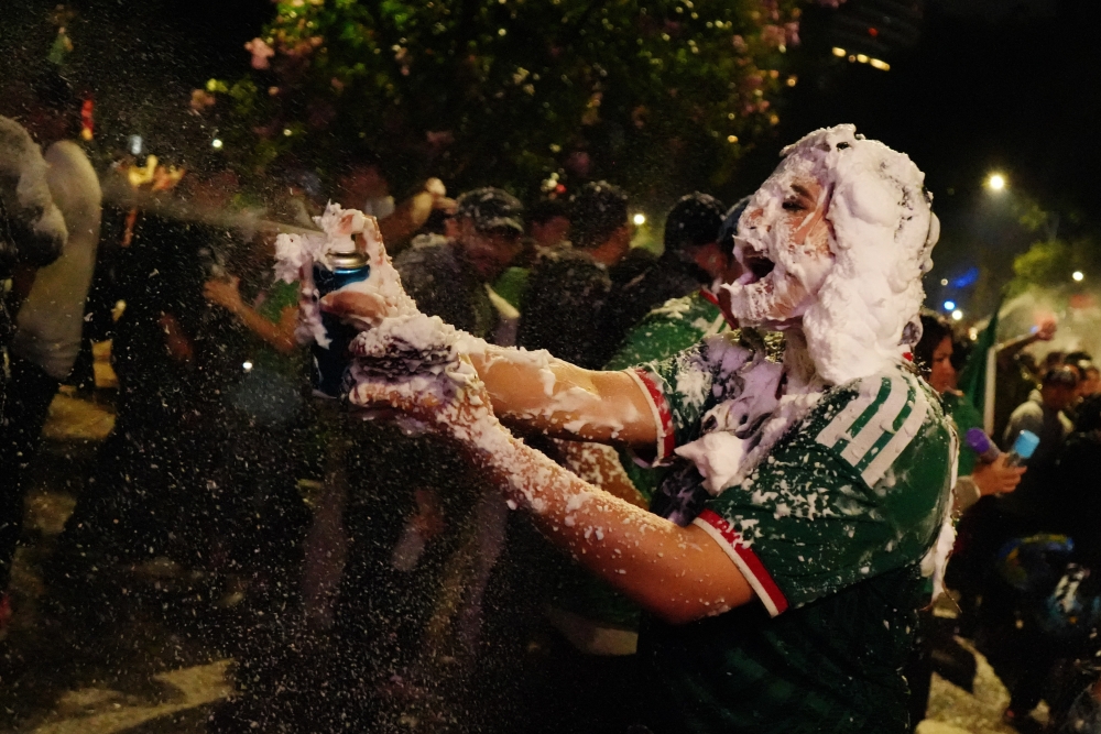  
A Mexico fan celebrates after the match 