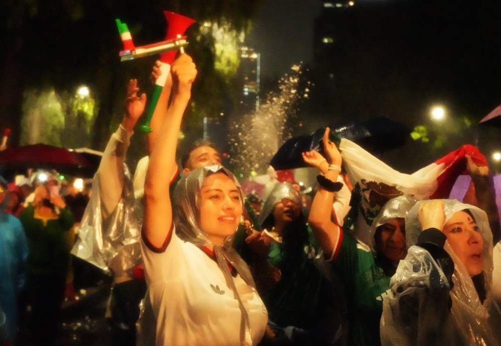  
Mexico fans react as they watch the match  