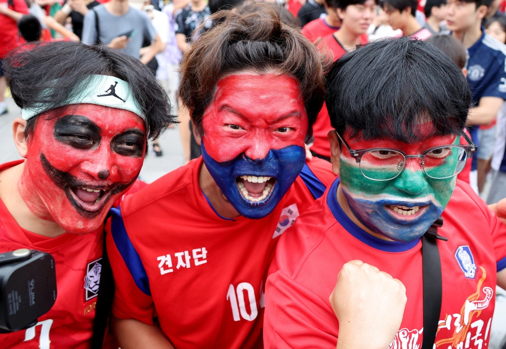  
South Korea fans react before the match  
