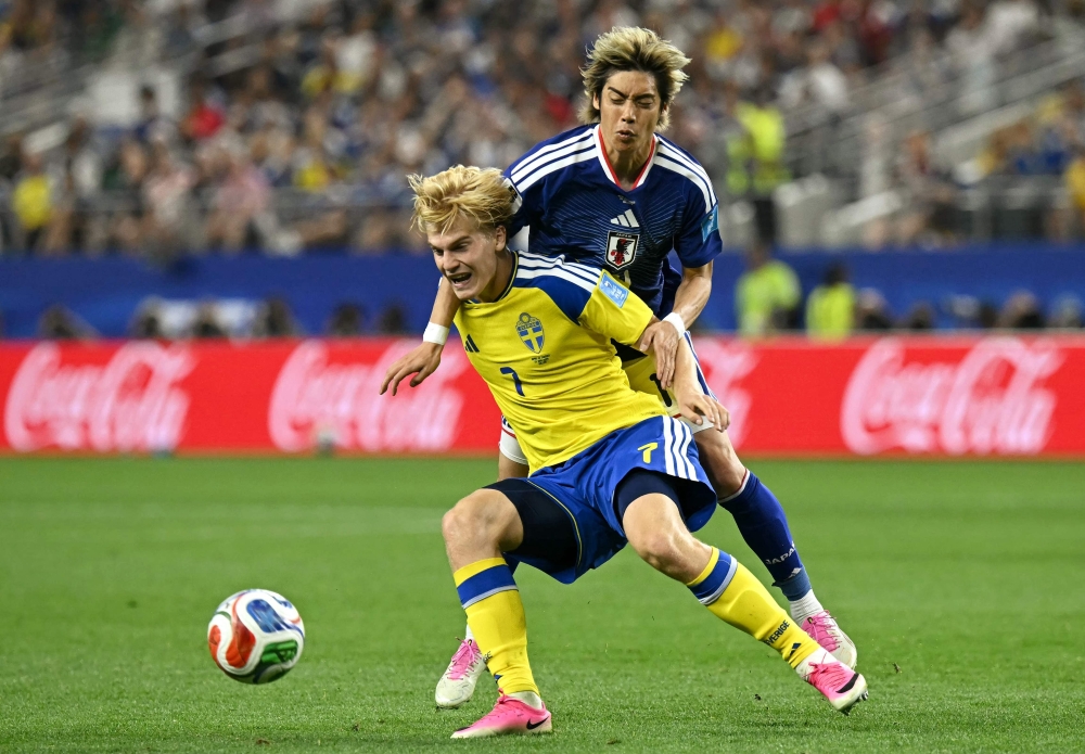 Sweden's #07 Bergvall and Japan's #14 Junya Ito. — AFP