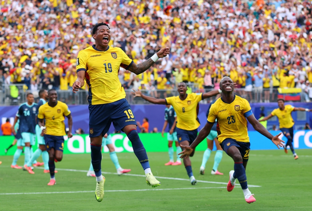  
Ecuador's Gonzalo celebrates scoring second goal with Moises. — Reuters